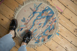Vintage Art Deco round rug mat with a pictorial scene, styled on the floor for scale.