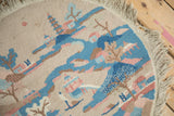 Close-up of the vintage Art Deco rug's soft, even pile and pictorial landscape design.