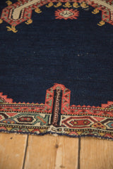 Hand-stitched addendum repair on the geometric border of an antique Persian saddle cover.