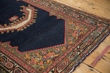 Detail of the antique Persian saddle cover's geometric spandrel and new blue side cord.