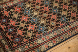 Antique Kurdish Malayer rug with geometric floral lattice design in ruby red, dusty blue.