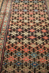 Antique Malayer runner's geometric floral lattice and meandering border; ruby red, charcoal, sky blue.