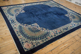 Corner of an Antique Chinese Art Deco carpet with cobalt blue field and elaborate peacock feather motifs.