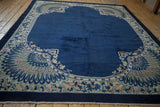 Antique Art Deco cobalt blue carpet corner, peacock design, scrolling tendrils in ivory, dusty rose.