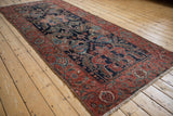 Malayer rug runner's navy field with dragon stylized leaves, ruby red border, and turtle samovar motif.