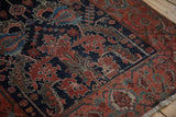 Antique Malayer runner detail showing ruby red palmettes and a turtle samovar border.