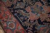Antique Malayer rug detail: ruby red border's turtle motif, navy field's dragon leaves, palmettes.