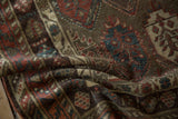 The soft, high-luster texture of an antique Kurdish Hamadan rug's fine wool pile.