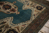 Pomegranate main border and shield-like overlay on the dusty sapphire blue field of this collector rug.