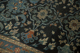 Evenly worn, hand-knotted pile showing scrolled leaves in dusty blue and beige.