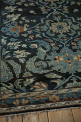 Angled view of the even wear and low pile on this vintage Persian Lilihan rug.