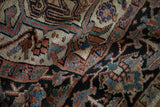 Vintage Gorevan carpet's textural pile, highlighting geometric buds and serrated leaves in gem-tone shades.