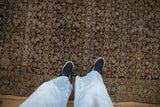 Hand-knotted texture and dense Herati design in chocolate brown on an antique Malayer rug.