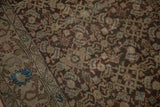 Antique Malayer runner's boteh and palmette border next to its chocolate brown Herati field.