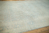 Detail of the vintage Meshed carpet's dusty blue Herati motif and samovar turtle main border.