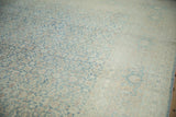 Distressed Herati pattern and softened pile texture on a dusty blue and cream Meshed carpet.