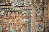 Vintage Mahal rug corner detail: Herati motif, pawn, and floral vine borders in rust, ivory, blue.