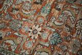 Herati floral palmettes in rust, ivory, denim blue, visible knot heads on vintage Mahal rug.