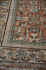 Vintage Persian Mahal rug corner with rust Herati pattern, ivory pawn minor border.