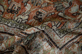 Textured pile of vintage Mahal carpet with rust, ivory, and chocolate Herati motifs.