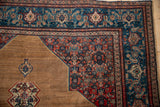 Finely woven corner spandrel with Herati design in brick red and sapphire blue on an antique Senneh rug.