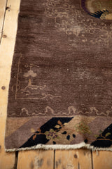Visible knot heads and foundation wear alongside the original side cord of a Peking runner.