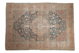 Distressed vintage Farahan Sarouk carpet with blue medallion, blush floral motifs, 6'11
