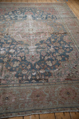 Distressed texture and faded floral patterns in dusty blue, blush, and sand tones.