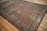 Antique Hamadan rug corner, displaying Herati field pattern, Samovar border, and visible worn pile.