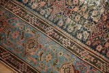 Antique Hamadan rug with Samovar border and Herati field patterns in dusty teal, blush, navy.
