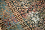 Detail of antique Hamadan carpet's Herati field and Samovar border in dusty blue, blush, and beige.