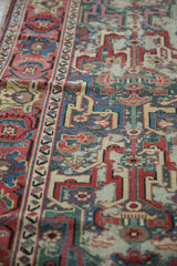 Textured raspberry red and dusty teal geometric arabesque on antique Caucasian runner.