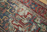Antique Caucasian runner with geometric arabesques, raspberry red, dusty teal, showing foundation wear.