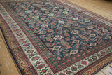 Antique Mahal carpet's navy field displaying vivid Herati-style geometric motifs.