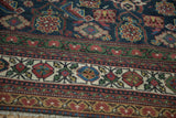 Geometric Herati pattern with rich multi-colored borders on an antique Persian Mahal carpet.