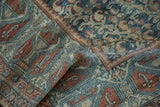 Distressed vintage Malayer rug: textured pile detail with teal, terracotta, ivory boteh patterns.