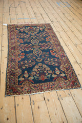 Left side detail of Antique Mohajeran Sarouk runner, showing painted red border and blue floral field.