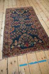Antique Mohajeran Sarouk rug's end, showing tattered fringe and original painted red border loss.