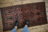 German Sarouk runner with contrasting dusty rose field and navy tree of life floral motifs.