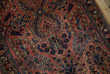 Detailed dusty rose German Sarouk runner with blue floral bouquets and vined plants.