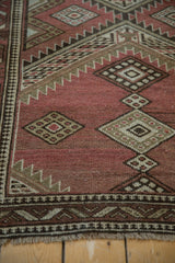 Faded cochineal red geometric pattern with pawn motif border and fringe on vintage Caucasian runner.