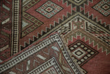 Vintage Caucasian runner: folded corner, geometric pawn motif border, fringe, and reverse weave.