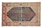 Antique Malayer rug with dark navy field, allover fuchsia and ivory boteh motifs, early 20th century.