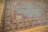 Antique Kermanshah carpet's scrolling Islimi main border in dusty aubergine and ivory.
