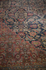 The intricate Herati design and hand-knotted texture of a vintage Bibikabad carpet.