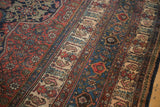 Intricate minor borders of a Persian Bibikabad with boteh and shrub designs on ivory and blue.