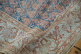Detail showing the high-low pile of a distressed Malayer rug with boteh and floral designs.