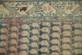 Distressed Malayer runner close-up with abrashes revealing terracotta and beige boteh motifs on dusty dark teal.