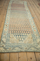 Distressed vintage Malayer runner showcasing a muted rainbow-like field of boteh motifs.
