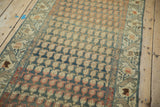 Distressed Malayer runner showing varied boteh patterns, softened teal, terracotta hues.